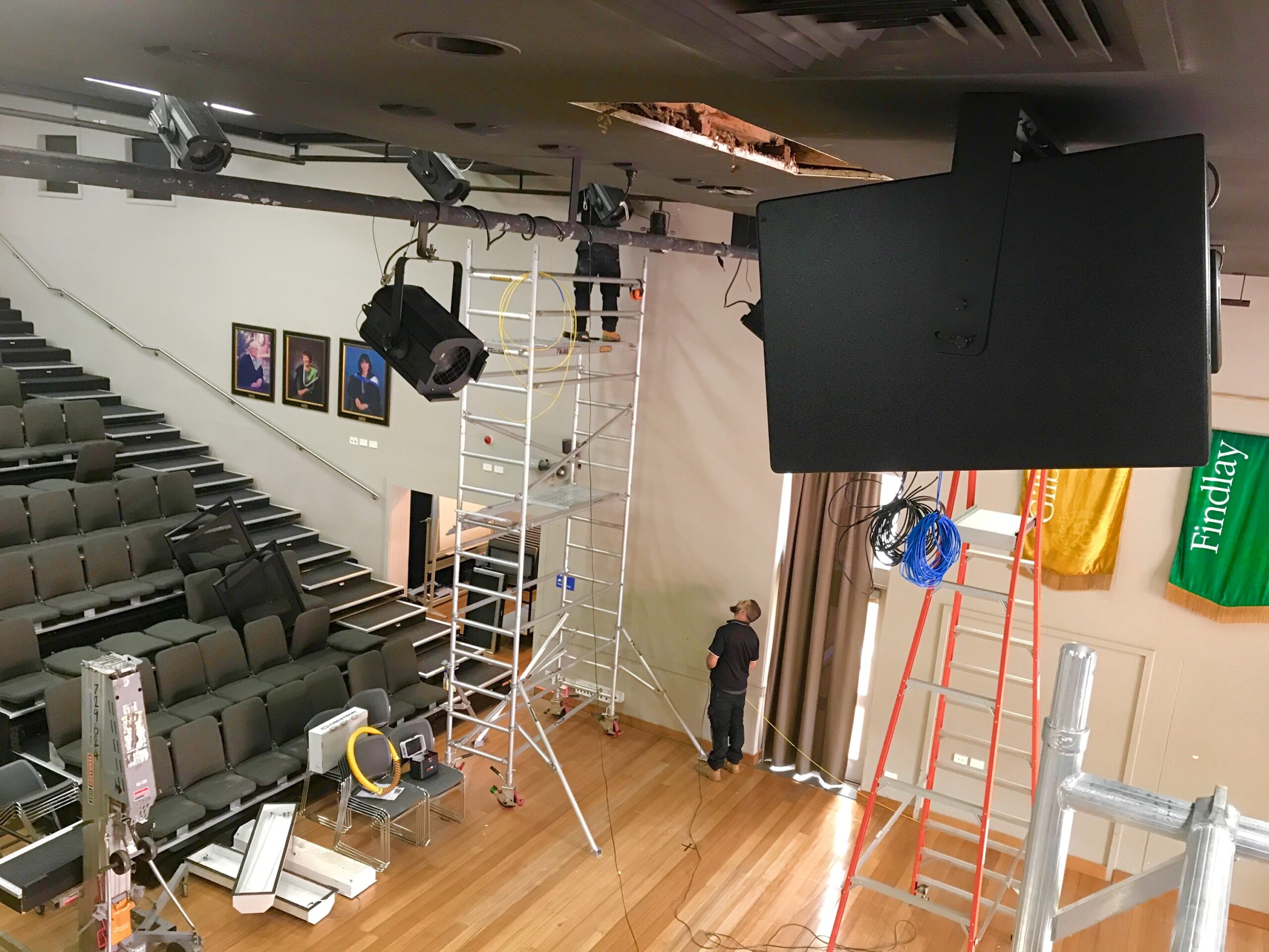 P C Audio Visual behind the scenes installation activities at school auditorium in Melbourne.